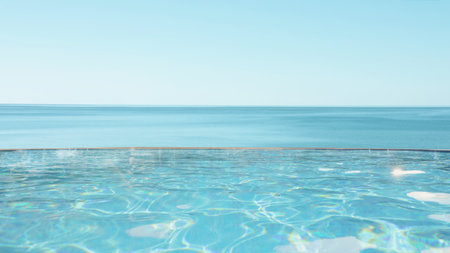 Infinity swimming pool with view on oceanの写真素材