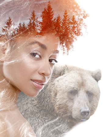 Beautiful woman and bear, double exposure. Collage on white backgroundの写真素材