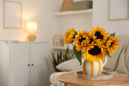 Beautiful sunflowers in vase on wooden table indoors, space for textの写真素材