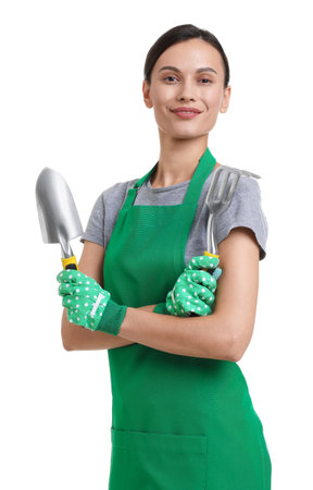 Portrait of gardener in apron with tools on white backgroundの写真素材