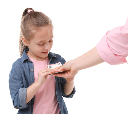 Mother giving her daughter pocket money on white background, closeupの写真素材