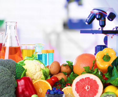 Food analysis. Laboratory glassware, microscope and fresh productsの写真素材