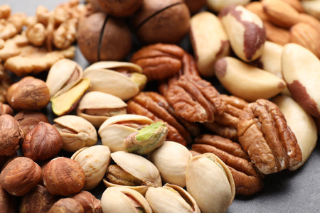 Mix of different nuts on gray table, closeupの写真素材