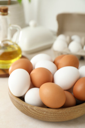 Raw eggs and butter on white counter, closeupの写真素材