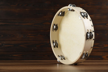 Tambourine on wooden background. Space for textの写真素材