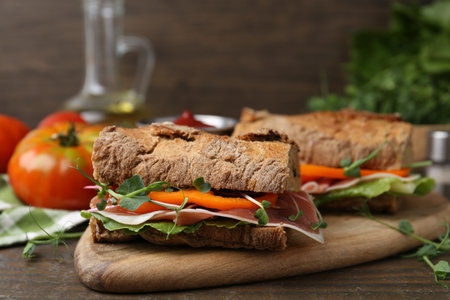 Tasty ciabatta sandwiches served on wooden table, closeupの写真素材