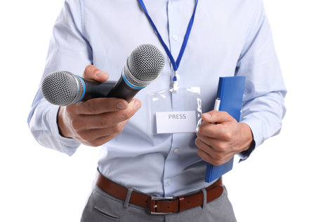 Journalist with microphones, notebook and pen on white background, closeupの写真素材