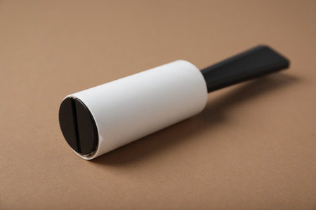 One lint roller on brown background, closeupの写真素材