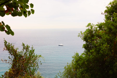 Modern ship on sea, view from mountainsの写真素材