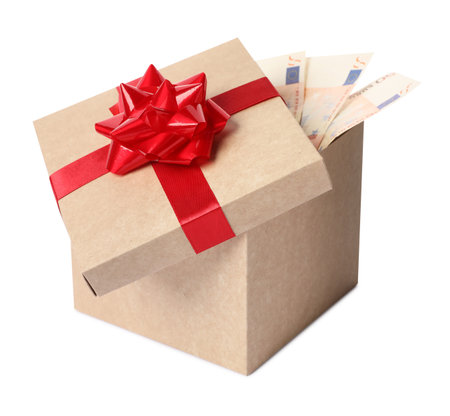Gift box with euro banknotes isolated on whiteの写真素材