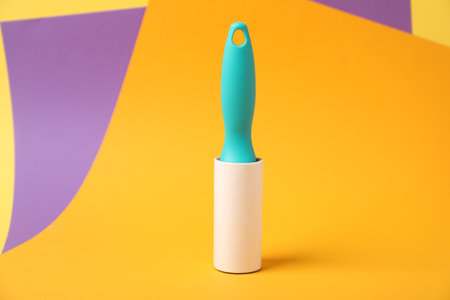 One sticky lint roller on color backgroundの写真素材