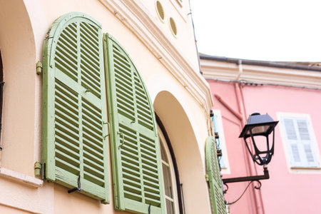 Building with green window shutters and lantern, closeupの写真素材