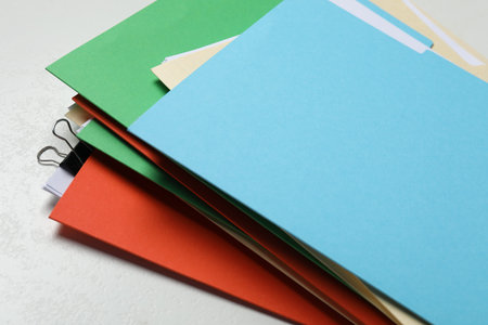 Many documents in folders on light gray background, closeupの写真素材