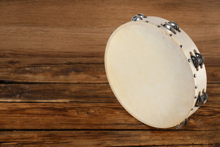 Tambourine on wooden background. Space for textの写真素材