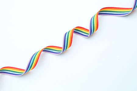 Beautiful rainbow ribbon on white background, top viewの写真素材
