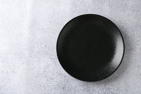 One stylish plate on gray table, top view. Space for textの写真素材