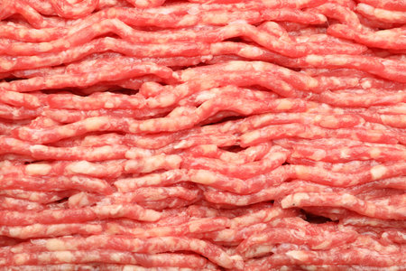 Fresh raw minced meat as background, closeup