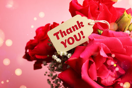 Thank you tag and flowers on pink background. Bokeh lightsの写真素材