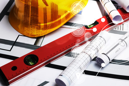 Engineering concept. Multiple exposure of construction drawings, bubble level, hard hat with...