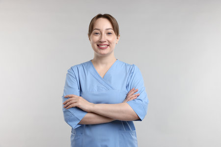 Portrait of professional nurse on light gray backgroundの写真素材
