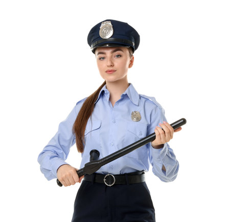 Young policewoman in uniform with baton on white background