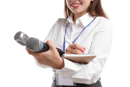 Journalist with microphones taking notes on white background, closeupの写真素材