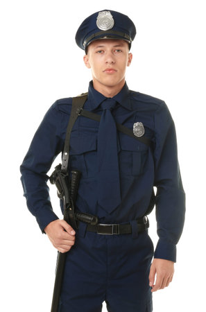 Young policeman in uniform on white background