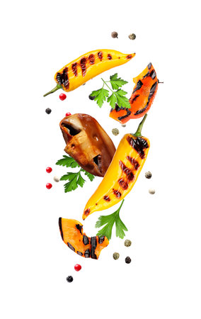 Grilled vegetables, mushroom, parsley and peppercorns falling on white backgroundの写真素材