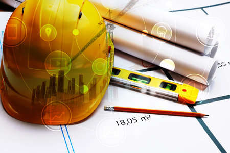 Engineering concept. Multiple exposure of construction drawings, bubble level, hard hat with...