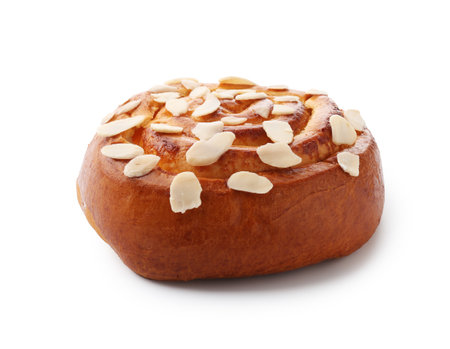 Tasty roll bun with almond flakes isolated on whiteの写真素材