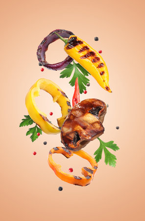 Grilled vegetables, mushroom, parsley and peppercorns falling on coral color backgroundの写真素材