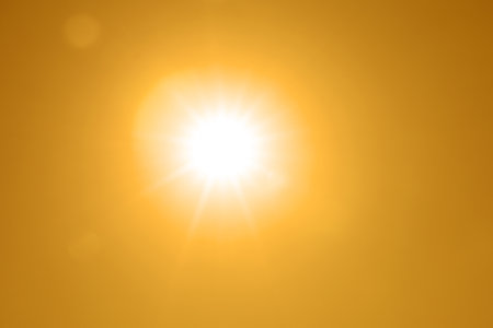 Bright sun in orange sky during hot summer weather. High temperatureの写真素材