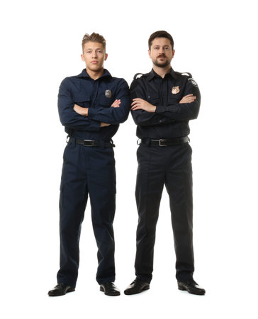 Policemen in uniform posing on white background