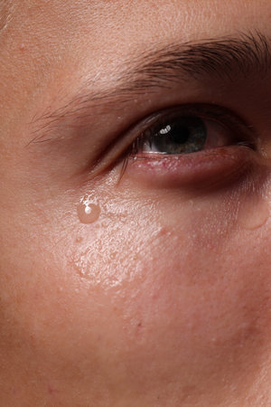 Closeup view of young man crying