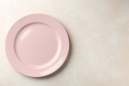Empty ceramic plate on white table, top view. Space for textの写真素材