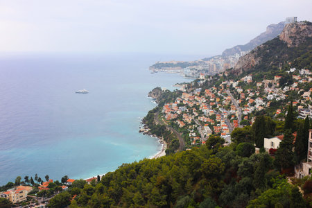 Aerial view of ship on sea and beautiful coastal city