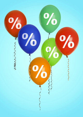 Bright balloons with percent signs on light blue background.の写真素材