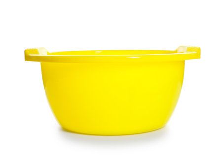 One yellow plastic basin isolated on whiteの写真素材