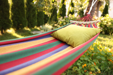 Comfortable cushion on colorful hammock in garden, closeupの写真素材
