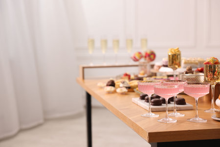 Buffet menu. Delicious desserts and drinks on table, selective focus. Space for textの写真素材