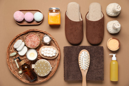 Flat lay composition with spa essentials on brown backgroundの写真素材