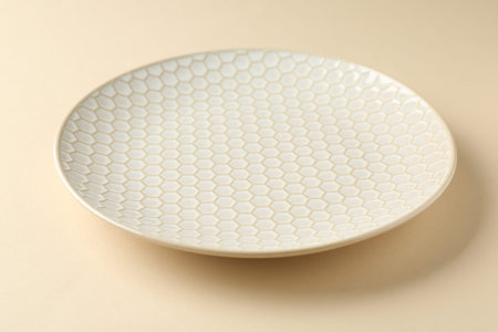 Stylish ceramic plate on beige background, closeupの写真素材