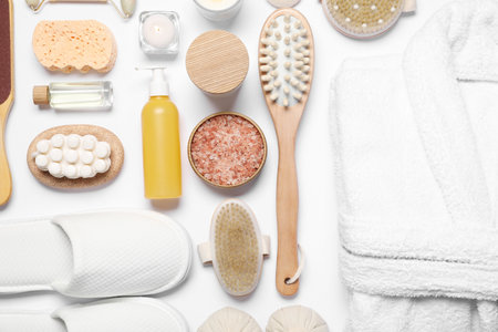 Flat lay composition with bathrobe and spa essentials on white backgroundの写真素材