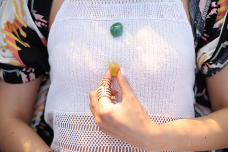 Woman meditating with crystals to heal or restore her aura, top viewの写真素材