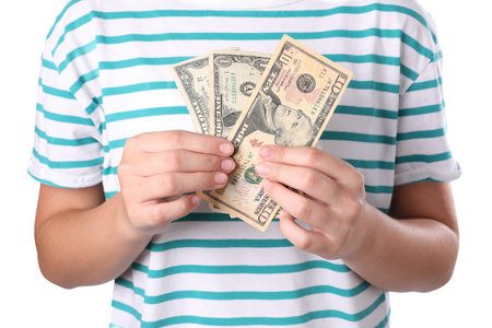 Girl with pocket money on white background, closeupの写真素材