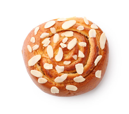 Tasty roll bun with almond flakes isolated on white, top viewの写真素材