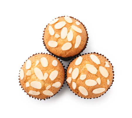 Tasty muffins with almond flakes isolated on white, top viewの写真素材