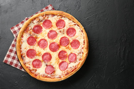Delicious pepperoni pizza on black background, top view. Space for textの写真素材