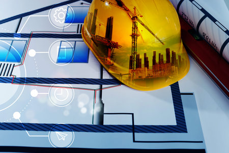 Engineering concept. Multiple exposure of construction drawings, hard hat with building site and...