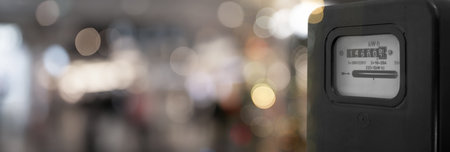 Electricity meter against blurred background. Banner designの写真素材